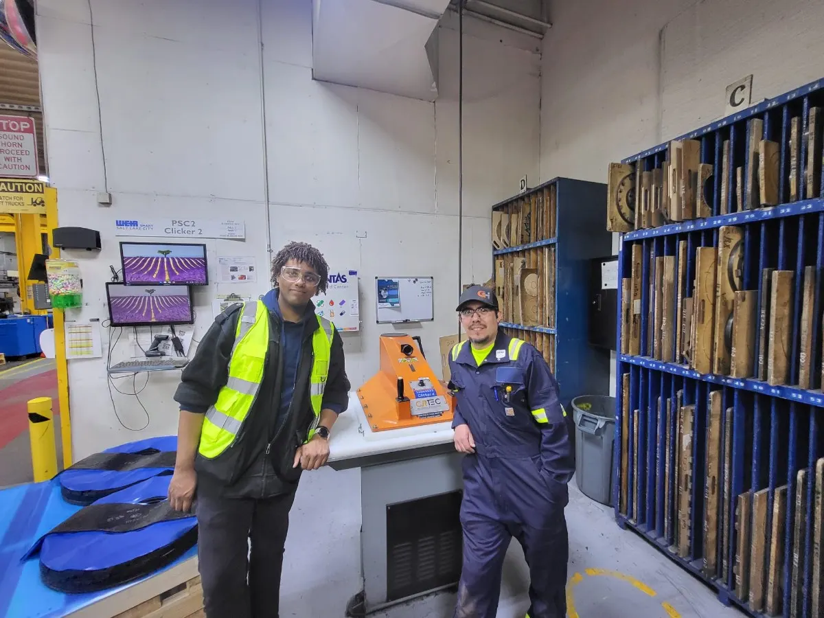 CPCON field workers in high-visibility vests at an industrial manufacturing facility