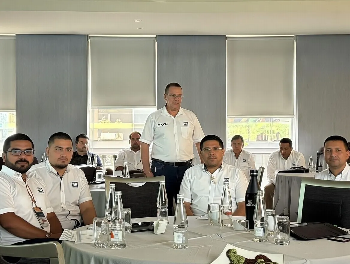 CPCON leadership team in branded white polo shirts at a corporate training session